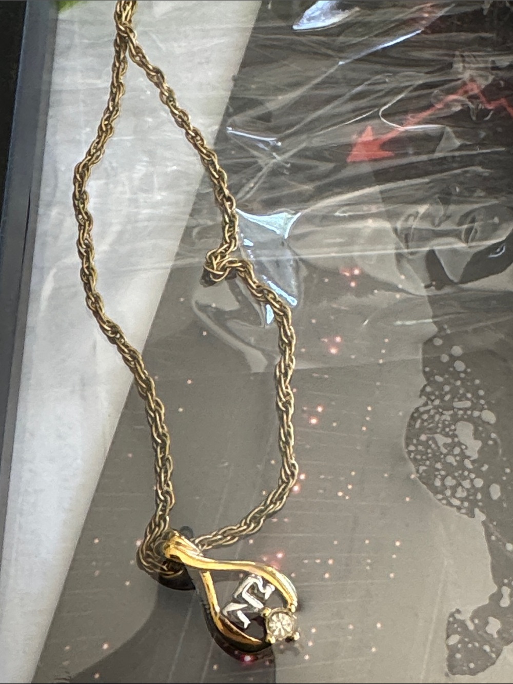 Nina Ricci Gold-Tone NR Logo Teardrop Pendant Necklace with Crystal Accent
